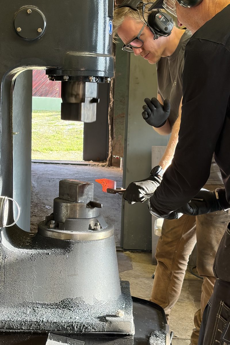 Hot steel being drawn out under the power hammer